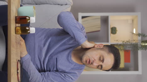 Vertical-video-of-Sick-man-suffering-from-neck-pain.